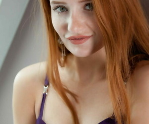 Redhead teen shows off her..